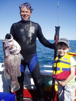 Photomanwithboyfish.JPG